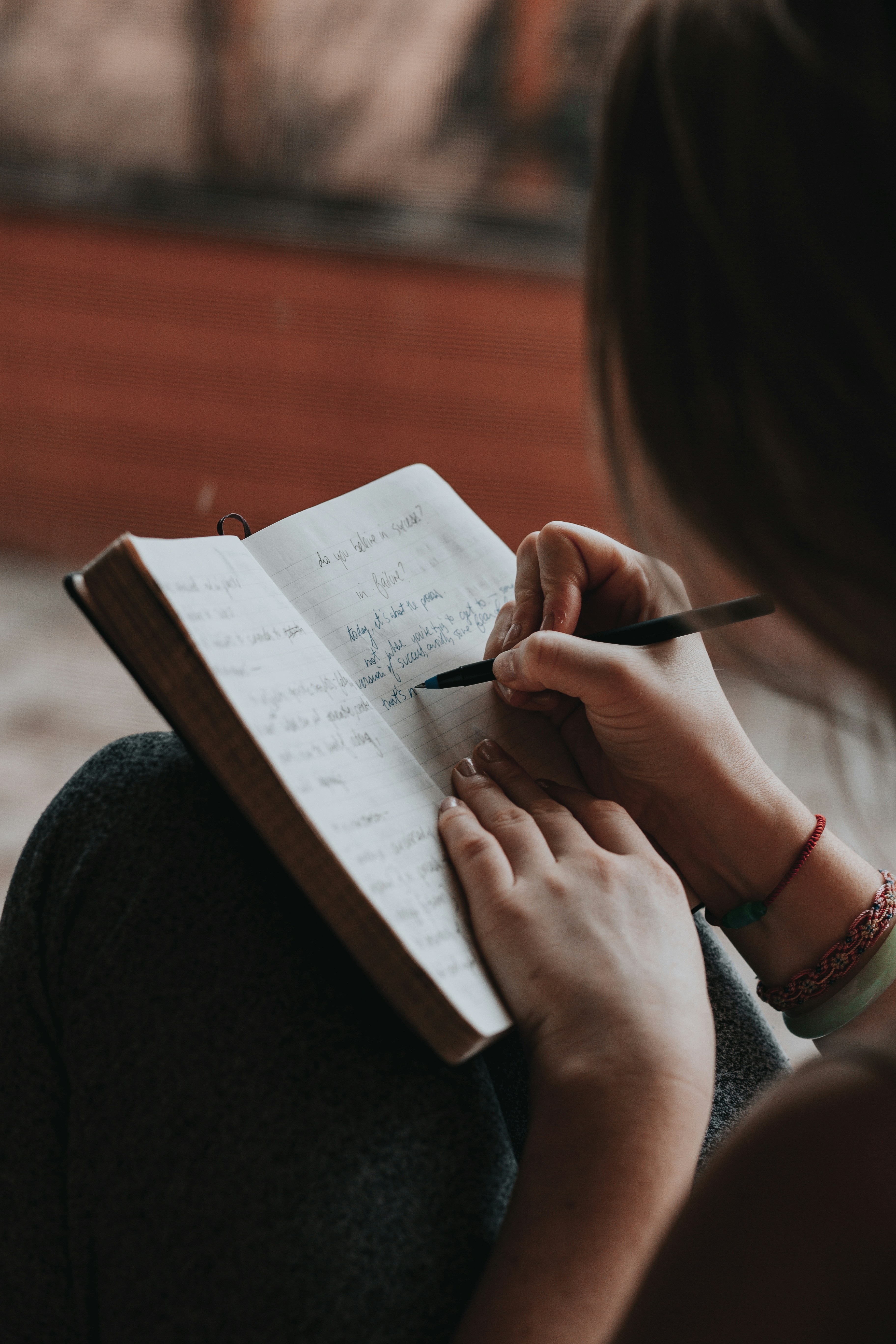 A person writing in a journal